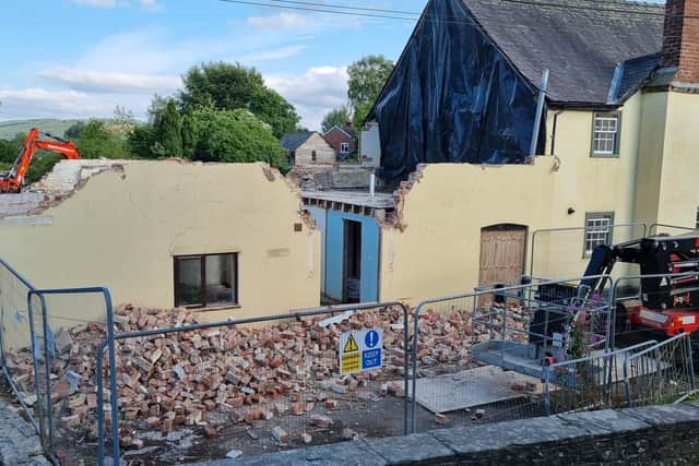 The Old Laundry house in the process of being demolished.