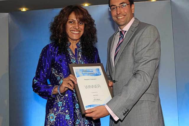 Shropshire Star editor Martin Wright presents the People's Champion Award to Julie Duhra in 2014