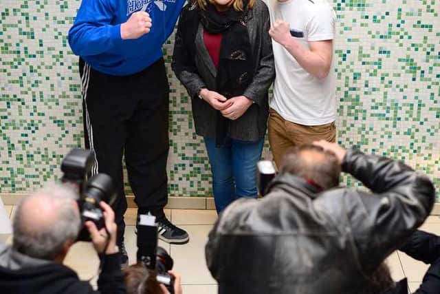 The press turn out for 'the Maloney factor' with Jones (right) enjoying the rub.