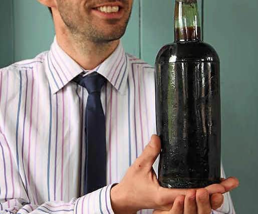Aaron Dean with the bottle