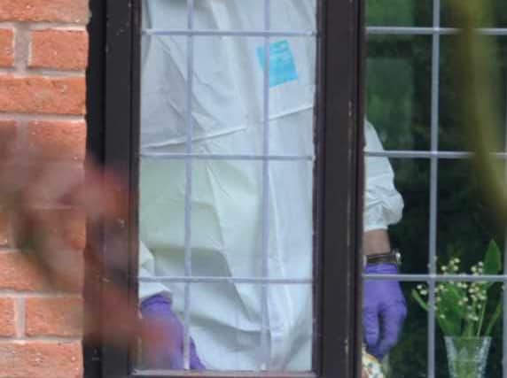 A police forensics officers at the house in Millfield Drive, Market Drayton