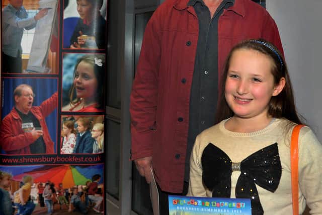 Letter-writing winner Lucy McGuire, from Moreton Hall First School, with Michael Morpurgo