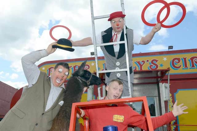 Clowns Bobbo Roberts. Front, from left, Jerry Samuels and Anthony Beckwith.