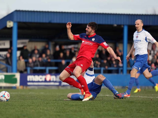 PENALTY - Andy Owens of AFC Telford United is brought down by Tom Hannigan of Vauxhall Motors to win a penalty