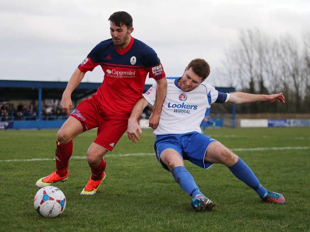 Andy Owens of AFC Telford United and Tom Hannigan of Vauxhall Motors
