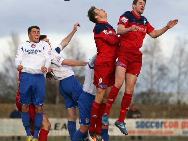 Dan Preston and Neill Byrne of AFC Telford United challenge for the ball