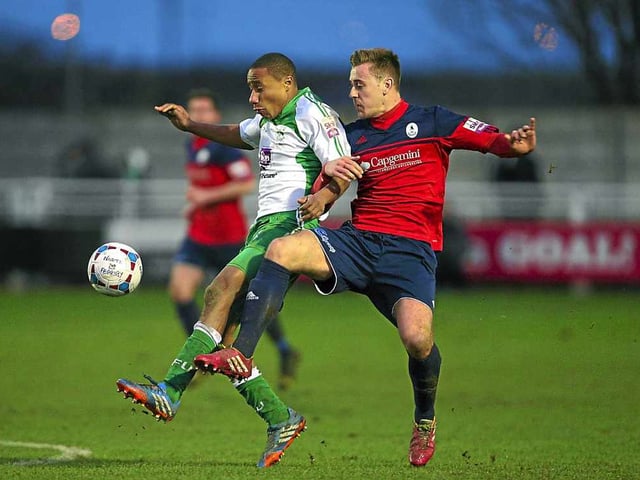 Jonathan D'Laryea of North Ferriby United and Adam Farrell of AFC Telford United