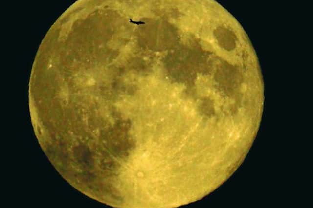 Jonathan Jonathan Hughes' photo of a plane passing over the moonHughes' photo of a plane passing over the moon