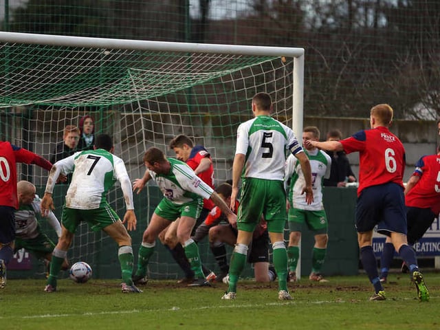AFC Telford United players appeal that the ball has crossed the Ferriby goal line during this goal mouth scramble