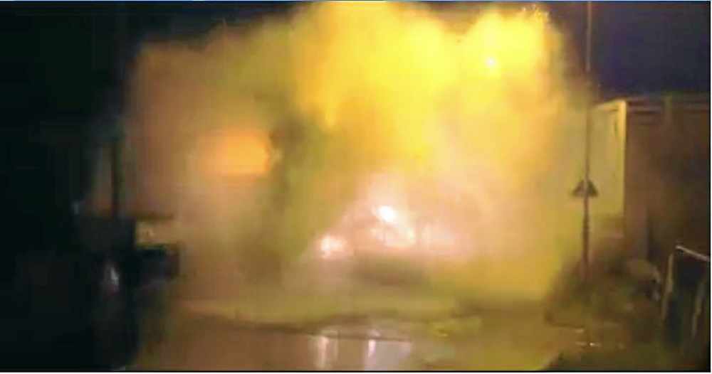 The vehicle creates a giant wave as it hits the water