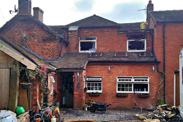 Firefighters tackle the blaze inside the home