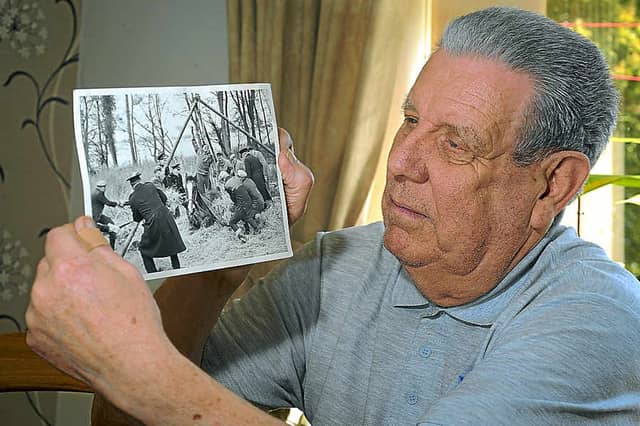 Frank with the picture of the rescue operation in progress