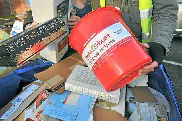 Volunteers Margaret Bowman and Howard Hutchings help recycle cardboard at the United Reformed Church as part of the fundraising effort