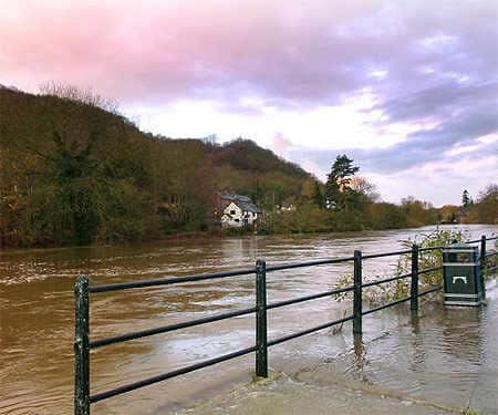 Ironbridge when The River Severn broke its banks as the water level rose and the flood barrier is protecting the Wharfage.