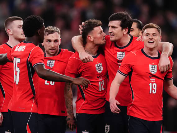 Ben White (centre) celebrates