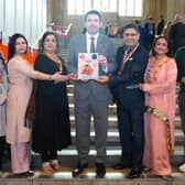 Shaun Davies earlier this month with organisers of the International Giddha Competition