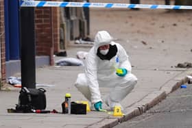 A forensic investigator at the scene in Friar Gate, Derby