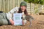 Wild Zoological Park at Half Penny Green Vineyard. They have been given a Staffordshire Tourism Award, and pictured is Deputy Head Keeper: Emily James, with new arrival: Esmerelda the Emu.