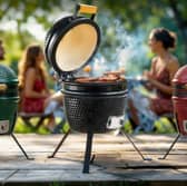A portable 13-inch Kamado BBQ grill offers versatile outdoor cooking for smaller gardens and gatherings