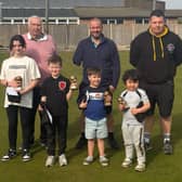 Four of the five junior juniors award winners are seen with Bandit Bowls team, from left: Roger Candlin, Jamie Brookes, Michael Cooper 