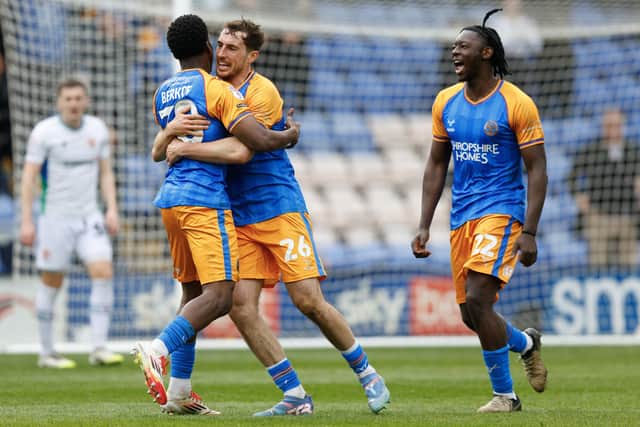 Sam Stubbs of Shrewsbury Town celebrates with Kevin Berkoe
