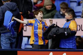 Supporters celebrate during the game between Shrewsbury Town and Tranmere Rovers