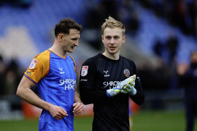 Will Boyle of Shrewsbury Town and Matt Cox (right) after victory over Tranmere Rovers