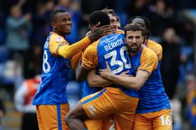 Sam Stubbs of Shrewsbury Town celebrates with his team mates after scoring a goal to make it 1-0