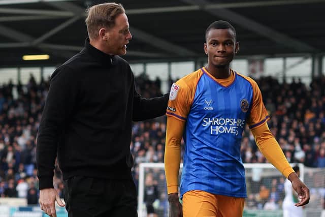 Boss Gavin Cowan with Bradley Ihionvien of Shrewsbury Town