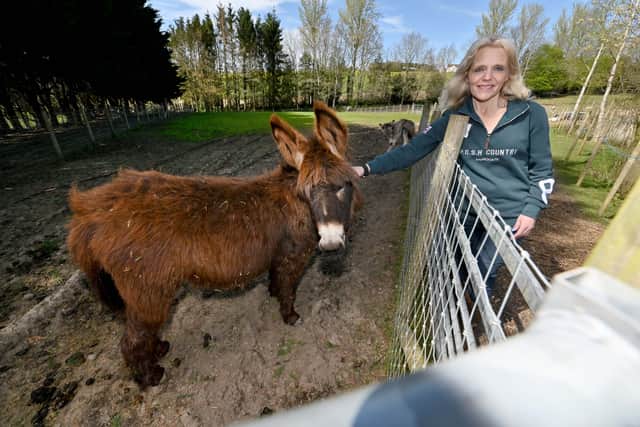 Amanda Ball, with Mini Cheddar the donkey. New paths have allowed access to the enclosure