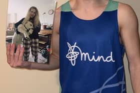 Joby Lloyd in his marathon shirt holding a picture of his sister Elsa Layton-Jones