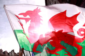 A Welsh flag with the sun in the background