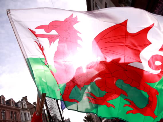 A Welsh flag with the sun in the background