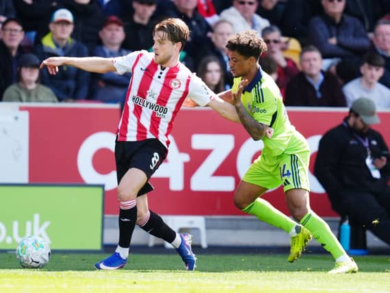 Brentford’s Mathias Jensen and Fulham’s Oscar Bobb (right) battle for the ball