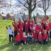 Pupils and staff at Ysgol Dolafon celebrating after their school as removed from Estyn’s list of schools requiring significant improvement following a positive monitoring visit.