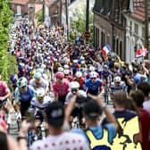 Crowds great the race during the opening stage of the 2025 Tour de France.
