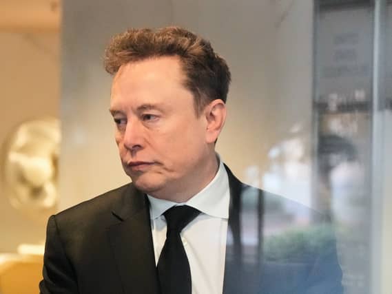 Elon Musk arrives at the US District Court in Oakland, California