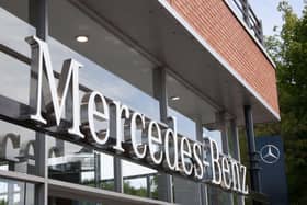 Mercedes-Benz logo at a car showroom