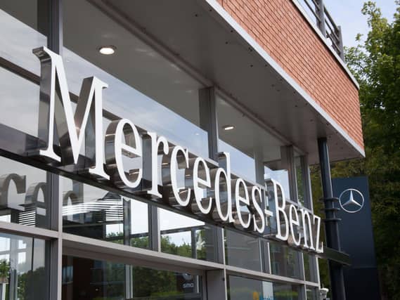 Mercedes-Benz logo at a car showroom