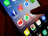 A mobile phone screen with various app widgets
