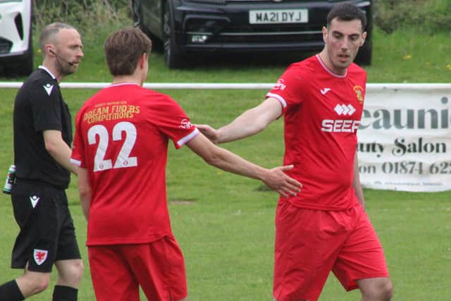 Joel Evans celebrates with Jamie Williams