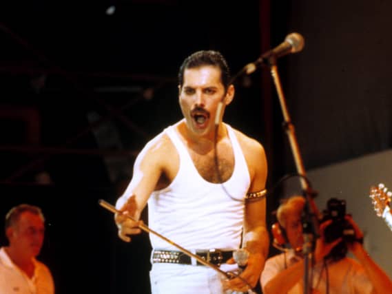Freddie Mercury of Queen on stage