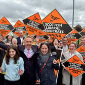 Alex Cole-Hamilton with his wife Gill and daughter Darcy surrounded by supporters