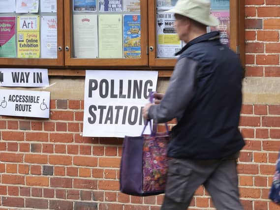 A man walks past the polling station in Saffron Walden Town Hall, Essex, during voting for the 2026 local elections
