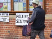 A man walks past the polling station in Saffron Walden Town Hall, Essex, during voting for the 2026 local elections