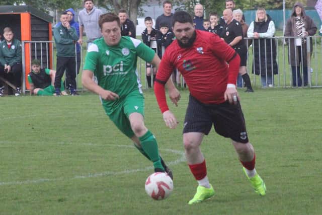 Action from the cup final clash at the Lant Field