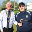 Proud debutant and man-of-the-match Rhys Marshall receives his county badge from, from left: selector Mick Jones, county president Andy Jones and selector Phil King