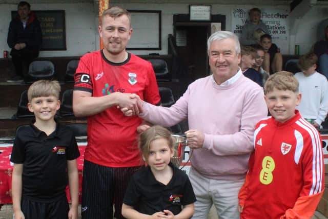 Frazer McAnally receives the cup from Pip Samuel Pics: Stuart Townsend