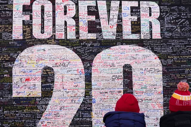 Fans at The “Forever 20” wall, a tribute mural in memory of Diogo Jota, ahead of the Premier League match between Liverpool and Wolves at Anfield