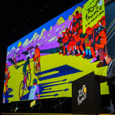 Tour de France Race Director Christian Prudhomme with the 2026 TdF Grand Depart creative during the route reveal event 